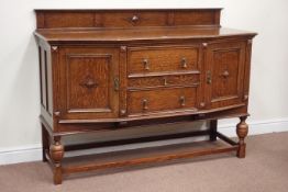 Early 20th century oak sideboard fitted with three central drawers flanked by cupboards,