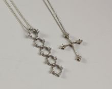 Stone set cross pendant necklace and an articulated stone set pendant necklace both stamped 925