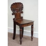 William IV period mahogany carved shell and scroll back hall chair,