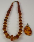Vintage amber necklace and a later pendant Condition Report <a href='//www.