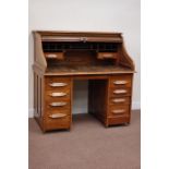 Early 20th century oak twin pedestal desk fitted with seven drawers and slides,