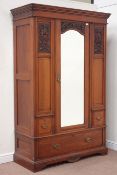 Edwardian walnut wardrobe enclosed by single mirror glazed door,