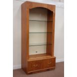 Oak finish illuminated shop's display shelves fitted with adjustable glass shelves and two drawers,