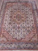 Persian Bijar hand knotted pale blue and peach ground rug, repeating Herati motif field,