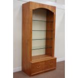 Oak finish illuminated shop's display shelves fitted with adjustable glass shelves and two drawers,