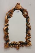 Gilt and green finish moulded foliage framed mirror with bevelled glass,