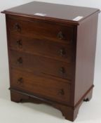 Miniature mid 20th century mahogany chest fitted with four drawers,