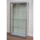 Metal and glazed illuminated display cabinets enclosed by two sliding doors,