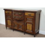 Late Victorian mahogany and walnut bowed breakfront sideboard fitted with four drawers and cupboard,
