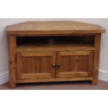 Stained pine corner television cabinet fitted with two cupboards, W105cm,