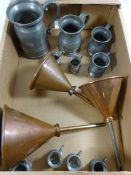 Five graduating 19th century pewter tankards and three copper funnels Condition Report