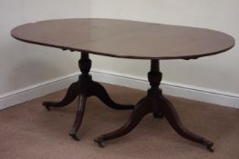Regency oval mahogany twin pedestal dining table, triple splay legs with hairy brass castors, W112,