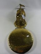 Brass wall bracket in the from of a ship and figurehead and a gong Condition Report