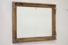 Gilt wood and gesso floral framed mirror,