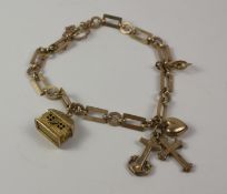 Gold chain bracelet of oblong and round links with charms hallmarked 9ct 12.