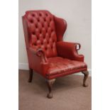 Georgian style wing back armchair upholstered in red buttoned leather,