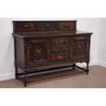 Early 20th century oak sideboard fitted with two cupboards and three central drawers,