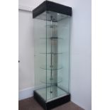 Glazed illuminated shop display cabinet, enclosed by single door,