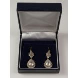 Pair of Belle Epoque old cut diamond pendant ear-rings, pear shaped diamonds approx 1.