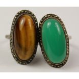 Tiger's eye and marcasite ring stamped silver and a similar green stone ring Condition