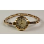 9ct gold ladies Swiss made wristwatch import marks London 1922 on Regent bracelet stamped 9ct