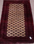 Turkoman Tekke red and golden ground rug,