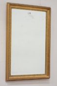 Gilt wall mirror with bevelled glass,