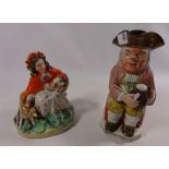 19th Century Staffordshire 'Spotty Face' toby jug and another Staffordshire figure 'Red Riding