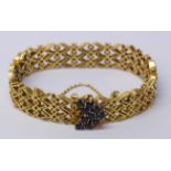 Gold heart shaped gate bracelet set with ten sapphires tested to 18ct approx 42.