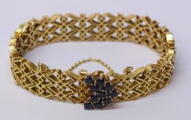 Gold heart shaped gate bracelet set with ten sapphires tested to 18ct approx 42.