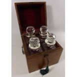 Edwardian oak decanter box containing four cut glass decanters with later silver collars H27cm
