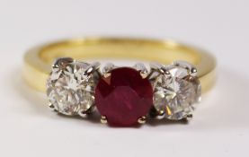 Ruby and diamond three stone gold ring hallmarked 18ct, ruby approx 1.1 carat and diamonds 1.