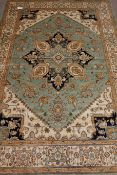 Persian Heriz style green ground rug,