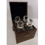 Edwardian oak decanter box with silver crest containing four cut glass decanters with later silver