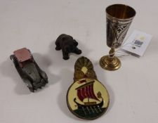 A small bronze model of a bear a novelty car pencil sharpener a small Niello goblet and an