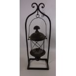 Wrought metal hanging lantern with stand, H64cm Condition Report <a href='//www.