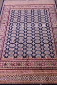 Persian Bokhara style blue ground rug,