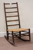 20th century country ladder back rocking chair with rush seat Condition Report
