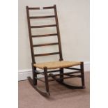 20th century country ladder back rocking chair with rush seat Condition Report