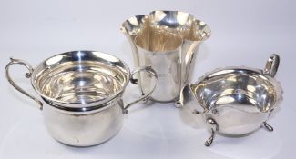 Silver porringer, sauce boat and quatrefoil vase all hallmarked approx 11.
