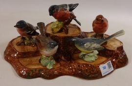 Beswick tree stump stand and five Beswick birds, Whitethroat, Chaffinch, Robin,