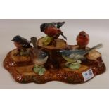 Beswick tree stump stand and five Beswick birds, Whitethroat, Chaffinch, Robin,