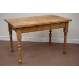 Rectangular pine dining table raised on turned base, 122cm x 76cm,