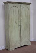 Rajasthan painted teak cupboard enclosed by two arched panelled doors, W115cm, H187cm,