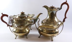 Four piece hallmarked silver tea set with shaped fretwork border by Ernest Druiff and Co Birmingham