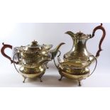 Four piece hallmarked silver tea set with shaped fretwork border by Ernest Druiff and Co Birmingham