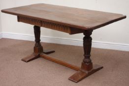 Early 19th century oak twin carved pillar table, plank top, fitted with two drawers, 159cm x 80cm,