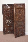 20th century Eastern heavily carved and fretwork three panelled folding screen,