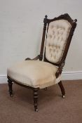 Victorian walnut nursing chair upholstered in beige buttoned fabric,