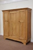 19th century French pine triple wardrobe, enclosed by panelled doors, W168cm, H176cm,